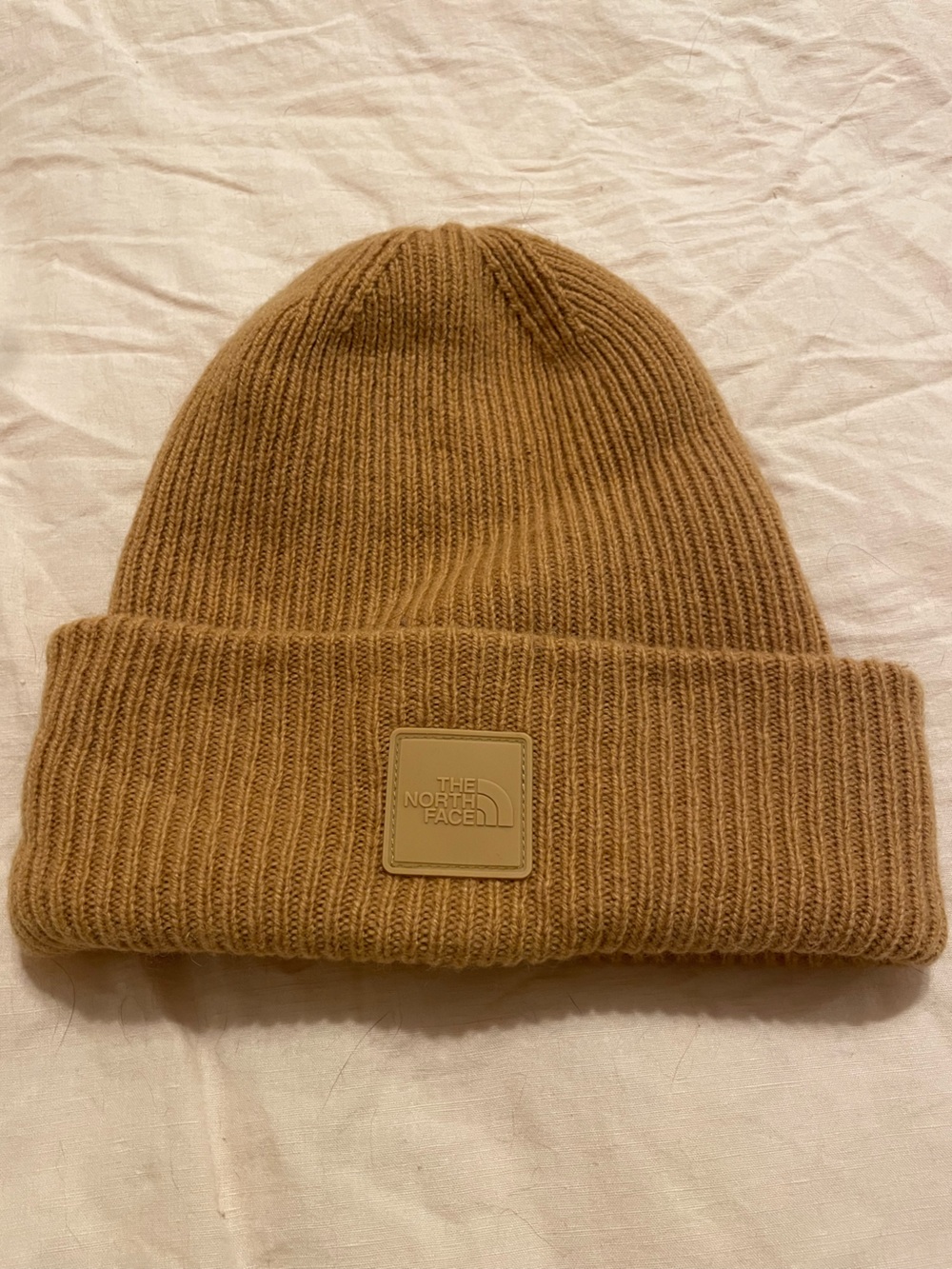 The North Face Men’s Tan Rib Knit Beanie, never worn.